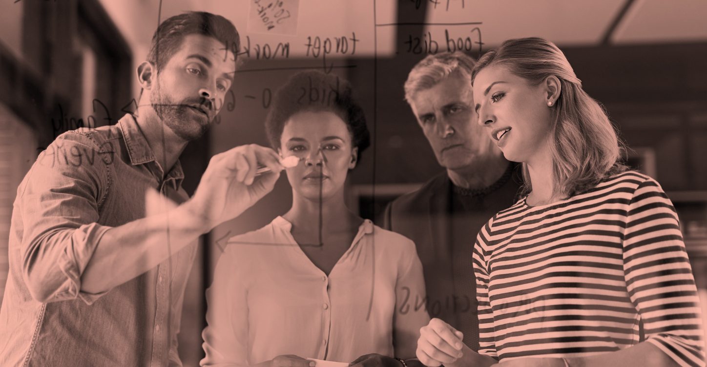 Photo of four people discussing a business strategy and discussing the Guide to Ordering Online Services on ComeUp