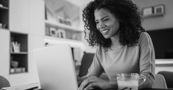 Woman reading the greatest alternatives to Upwork article and finding the alternative that's right for her.