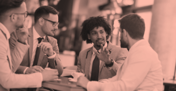 A group of business owners discussing sites similar to Fiverr to grow their businesses.