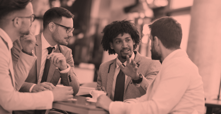 A group of business owners discussing sites similar to Fiverr to grow their businesses.