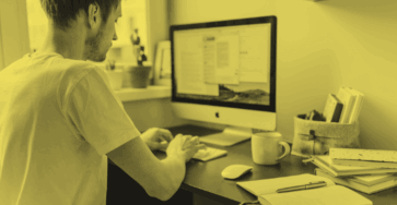 A freelance web designer working on his computer.