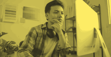 A digital marketing strategist working on their computer