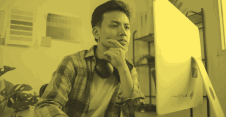 A digital marketing strategist working on their computer