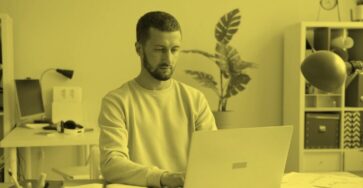 A Webflow expert is working on his computer.